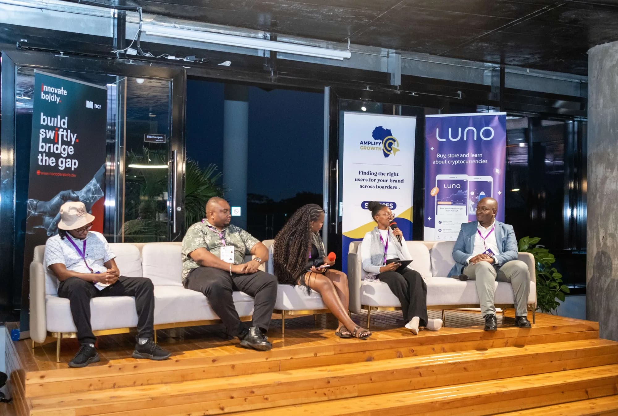 Four panellists on stage at the Nairobi Tech Christmas Mixer