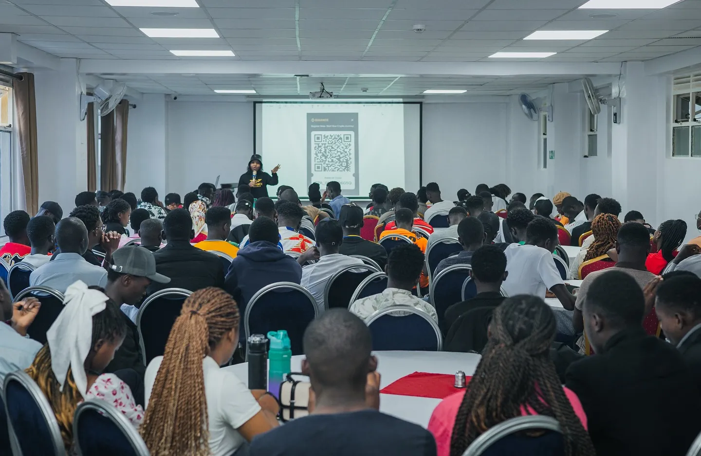 A full hall listens to a talk at an Amplify Africa session